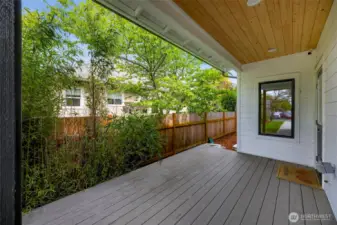 Covered back porch.  There is a sizable side yard that can be fenced for privacy or pets.