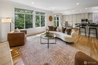 'Great room' with gas fireplace and stairs to the back garden