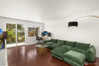 Spacious living room with sliding doors to balcony