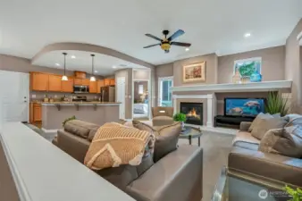 The great room is quite large and has a gas fireplace, a large TV niche and a huge display mantle.