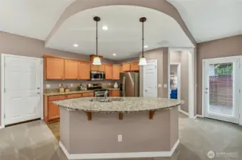 The kitchen has loads of cabinets, a pantry and the slab granite counters are beautiful. Add a couple of stools for casual dining at the island. Stainless steel appliances: dishwasher ~ 8 months old and fridge is ~ 2 years old.