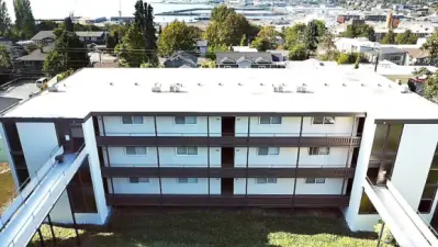 Aerial View of front of building with a view of the bay