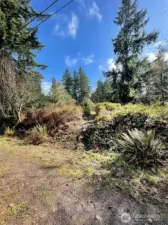 Entrance to the property off of Bank Road. Trail runs through the entire lot, passing through meadow and forest.