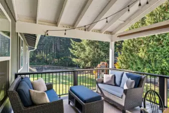 Cozy back deck space with views of the back yard and 100 Acre Woods.