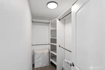 Primary bedroom walk-in closet.