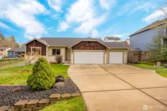 Spacious driveway + 3 car garage