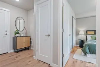 Entry level bedroom and garage access. Photos are of model home in the community.