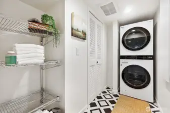 Laundry in basement w/built in ironing board.