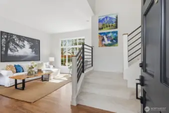 An inviting living room highlighted by vaulted ceilings and abundant natural light.