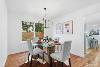 Dining room space seamlessly connecting the living room and kitchen with gorgeous backyard views.