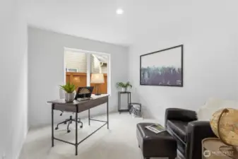 Private main-floor office featuring new millwork, paint and carpet.  Located conveniently off of the family room.