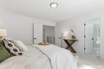 Spacious primary suite with a large walk-in closet and ensuite bathroom.