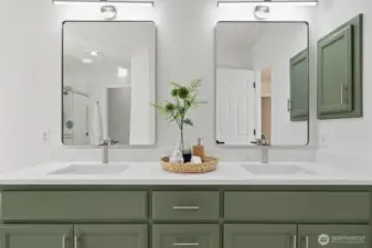 Stunning double-sink vanity with new undermount sinks, stylish mirrors, modern lighting, and updated faucets/hardware.