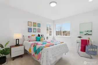Spacious and sunny bedroom featuring a large closet and Mt. Si views.