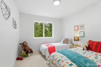 Another oversized bedroom with closet and lovely backyard views.