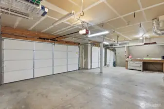 3-car garage with shop area and new LiftMaster 8550W belt-drive opener, including remote, battery backup, and keypad.