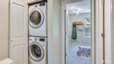 Laundry is conveniently located upstairs between both bedrooms.