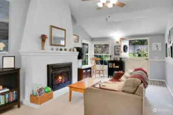 A view of the living room from the dining room table .Note the cheerful Dutch door...letting in sunshine and fresh air!