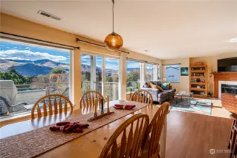 Dining area opens to deck with BBQ