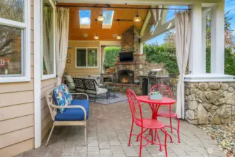 Amazing outdoor living area with built in fireplace, bbq, fridge, skylights and surround sound.