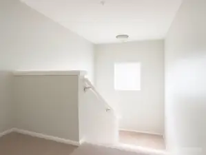 Looking down toward the lower level—a peaceful and open layout with room for all.