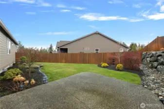 Back/side yard. Extended back patio for BBQ's and furniture. HOA takes care of the landscape, sprinklers and fence.