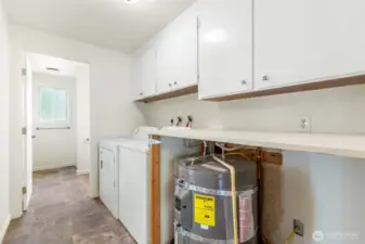Utility room off of kitchen with .75 bath