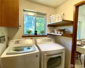 Light & bright laundry room with storage, washer & dryer included!