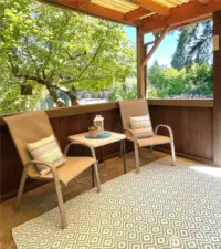 Cute covered back patio for convenient outdoor entertaining.
