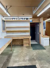 Upon entrance into garage. Workbenches, storage and steel door to safe room.