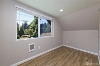 This is a small room adjacent to the updated bathroom that this seller used as the Primary closet area. Used for dressing space, clothes dressers, etc. Could also be a little sitting room or office?