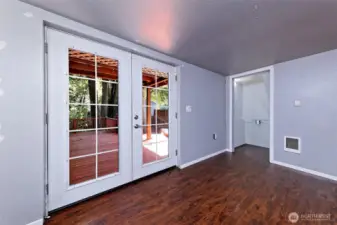 Another view of the lowest floor - that's the closet straight ahead. And the French doors leading to the beautiful deck.