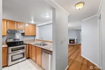 Kitchen flows into dining and living areas. Virtually staged.