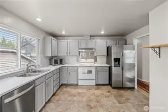 Laminate countertops and brand new stainless steel dishwasher.