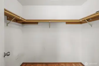 Spacious walk-in closet for ample storage.