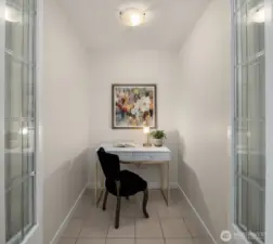 Office nook with folding glass doors offers a place for privacy.  Could also be a dressing room, or whatever else you need!