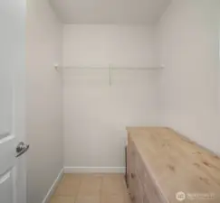 Across the hall from the bathroom you'll find the walk-in closet - currently inside is a large dresser yet still tons of space.