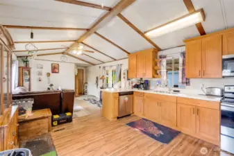 View of living room and doorway to primary bedroom