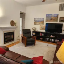 The spacious Living room boasts a natural gas fireplace for those cozy winter nights.