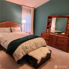 Windows on either side of the bed let in the morning light.