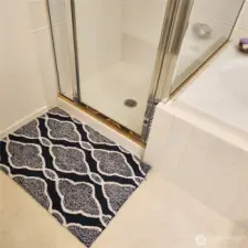 Glass doors in the shower let the light in.