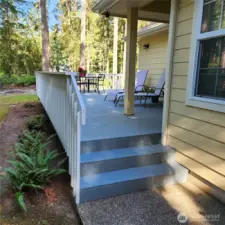 Steps on the ide of the house for entry onto the back deck (which can also be accessed from the slider in the living room)