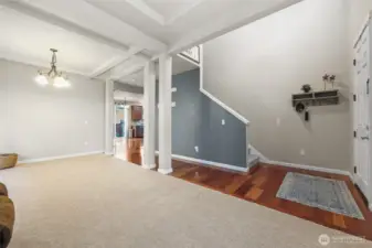 Brand new carpet throughout the house! Coffered ceilings and posts bring an elevated style to this formal dining and living room area.