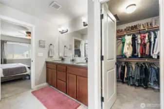 Walk-in closet has plenty of space, situated inside the bathroom for extra ease.