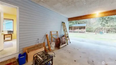 Carport showing door to additional room.
