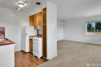 Dining room looking into kitchen and living area.