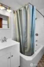 Bathroom with tile backsplash.