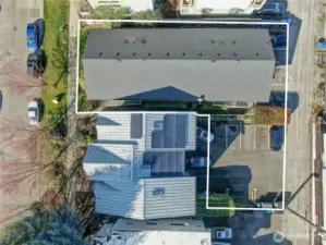 Property includes the lower parking lot behind neighboring townhomes with easement for ingress and egress.