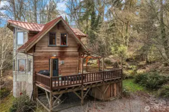 Tucked into the hillside and built with loving care, this home is a delight for all the senses.