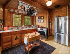 Kitchen has hand-built custom cabinetry made from CVG Fir.
